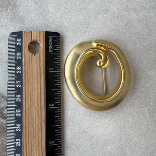 Broche ronde dorée