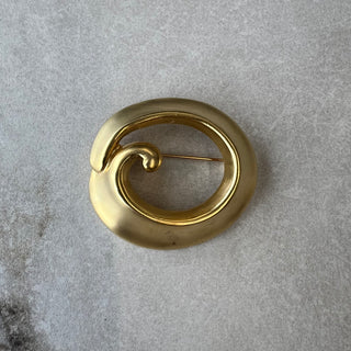 Broche ronde dorée